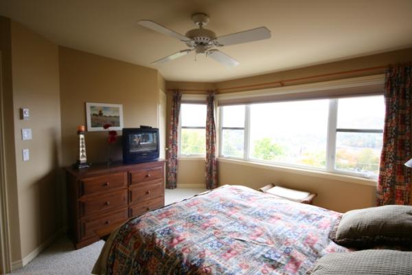 Master bedroom on third level with Queen and TV