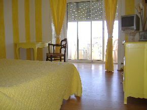 Bedroom with en suite bathroom and balcony
