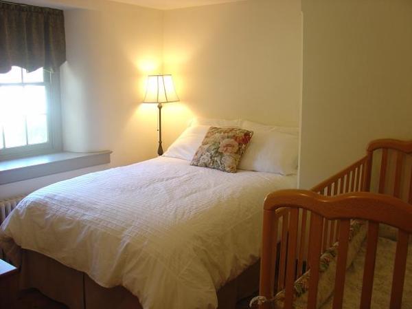 Bedroom with Full-Sized Bed and Full-Size Crib