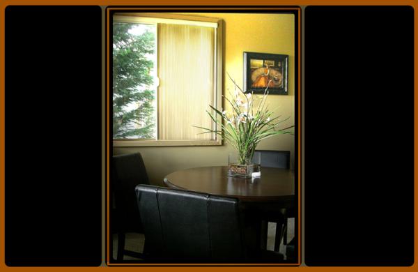 dining area overlooks deck, yard & mountain range