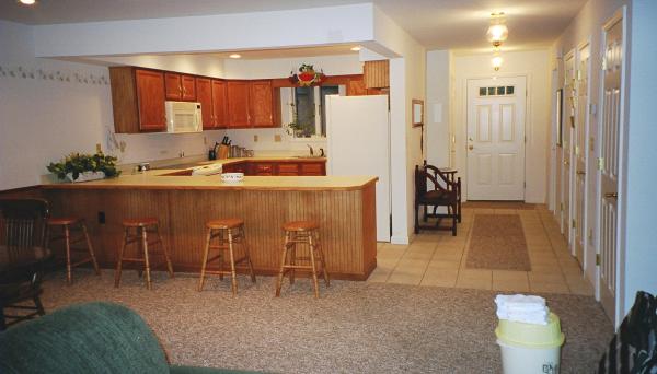Bar and hall with laundry, bath, closets