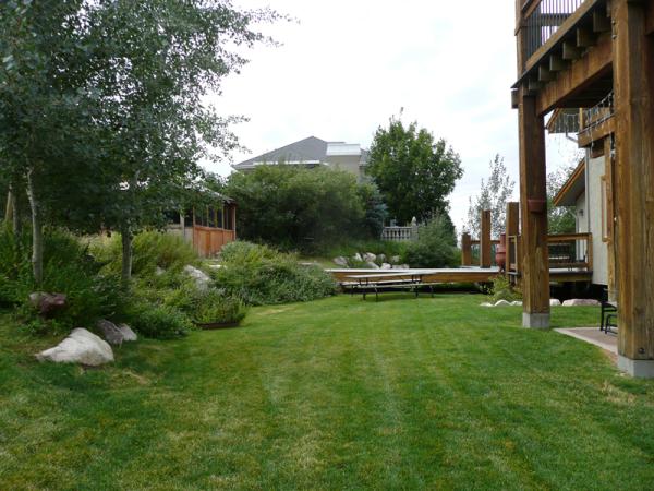 Backyard, swing set and gazebo and spa