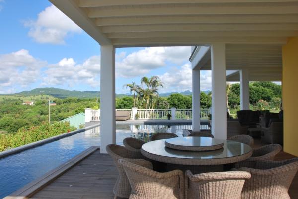 Pool and covered terrace with seating