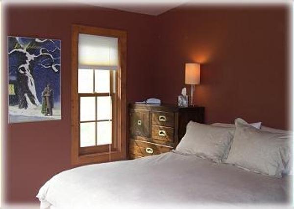 Beautiful master bedroom with doors to the deck