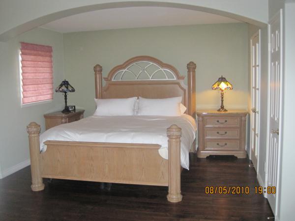 Master bedroom with comfortable king sized bed