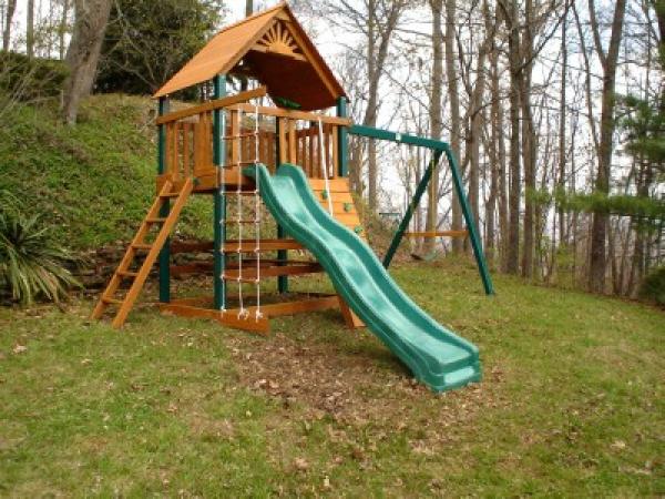 Fort w/swings, slide, climbing wall, rope ladder!