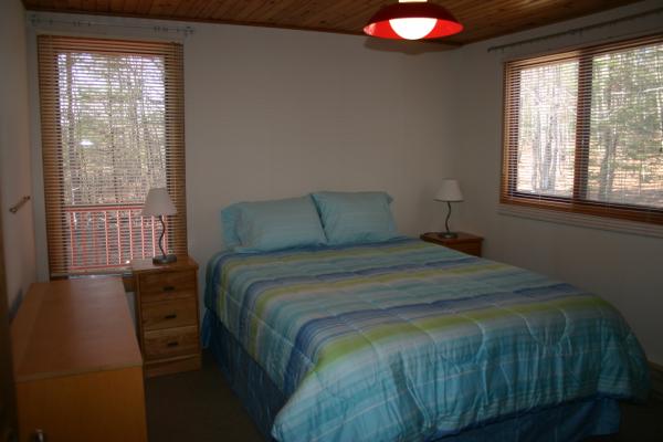 main floor bedroom with queen bed