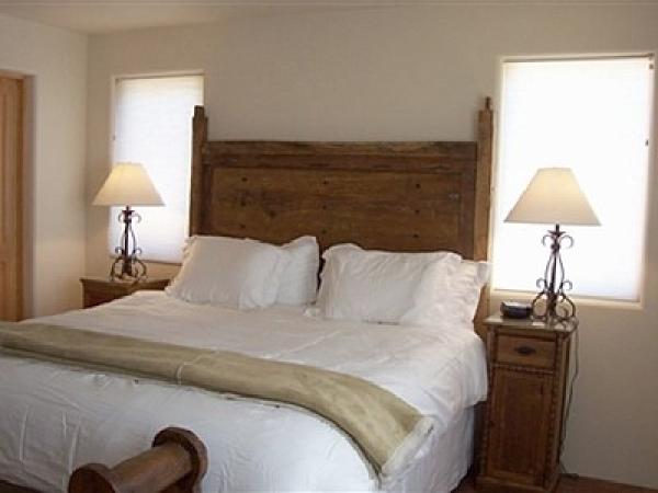 Master - king size bed with antique headboard