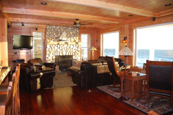 1st floor living room w/ river rock fireplace