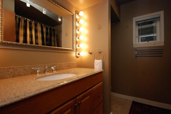 Bathroom with tub and shower and granite counter