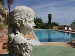 View of pool and sculpture