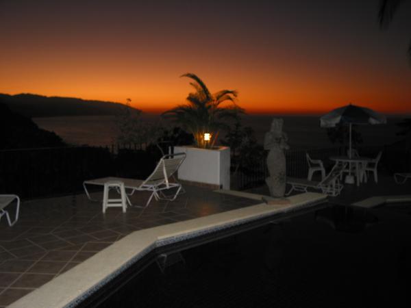 sunset by the pool