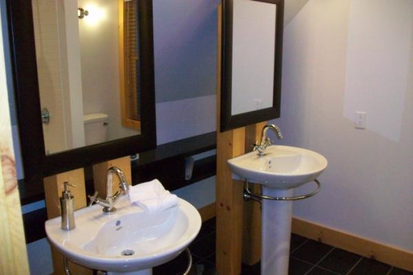 Master bathroom with bath tub and shower combinati