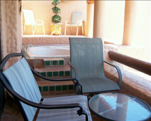 Master balcony with jacuzzi and lounge area. 