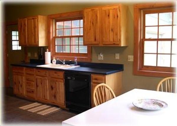 A complete kitchen with a dining table