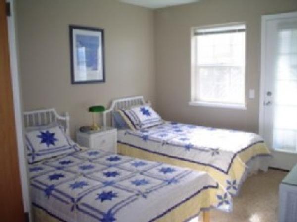 2nd bedroom with deck outside & adjoining bathrm.