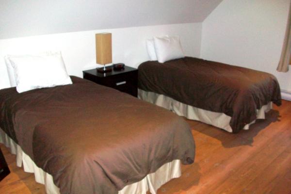 Second bedroom on top level with two single beds	