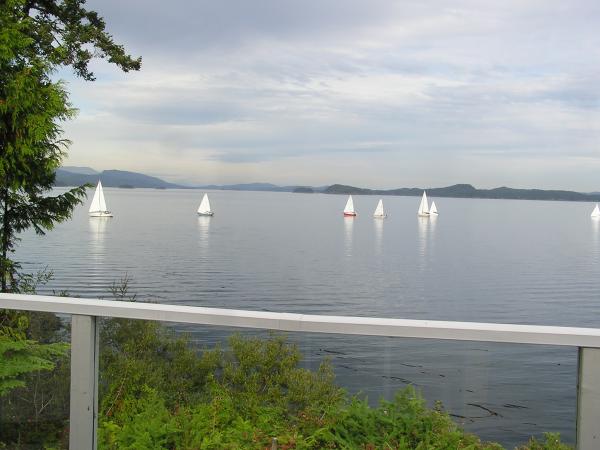 Yachts and boats cruise past your balcony.