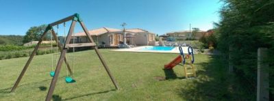 Children's play area with swings and slide