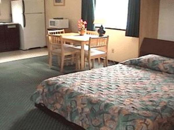 Bed, Table, and Kitchenette