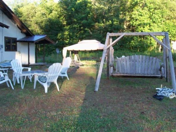 Outside Sitting Area. 2 Swings and Gazibo.