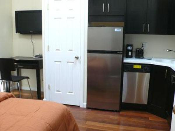 Different View of Bedroom with Big Screen TV