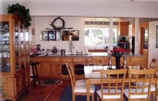Dining area to wet bar and counter to kitchen