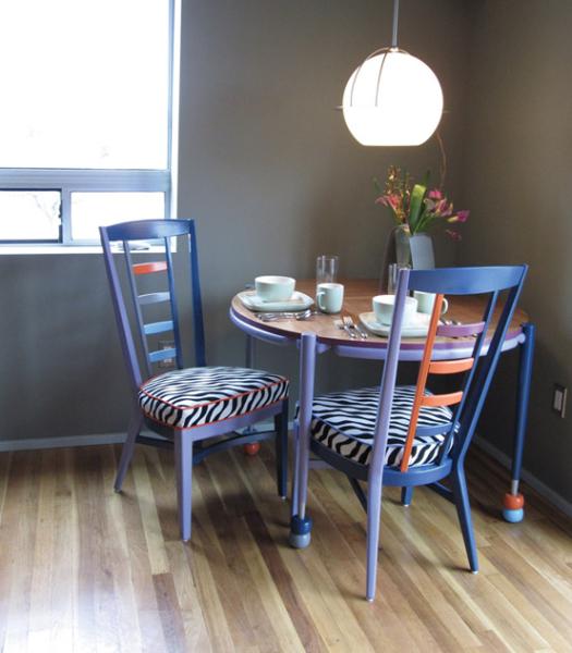 Dining area w/furniture by local artist