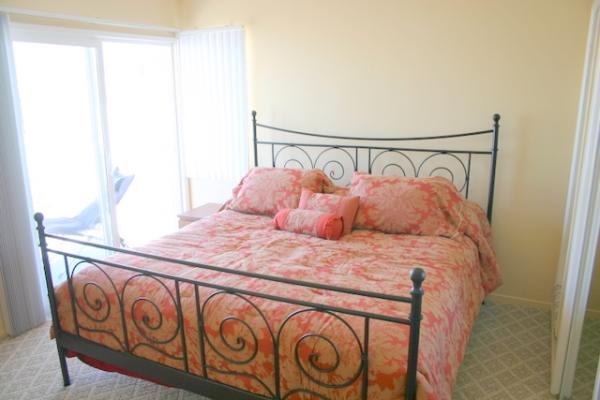 King bed opens to oceanfront balcony.