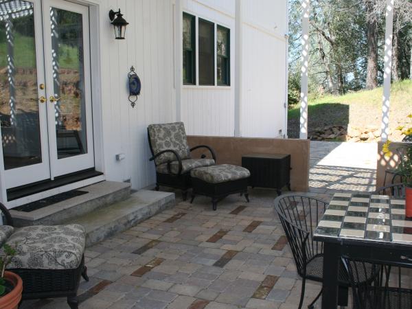 Shady Outdoor Patio adjoins the Kitchen