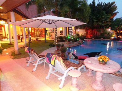 Relaxing evening beside pool