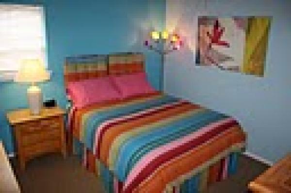  2nd bedroom with Queen sized bed and vanity 