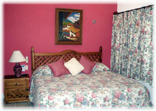 This upstairs master suite, off the screened porch