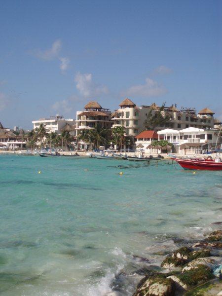 El Taj Ocean is the building with palapas on roof