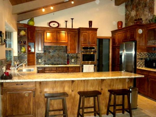 Custom cabinetry, stainless steel apps, granite