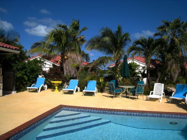 Relax at the pool with a cold drink.