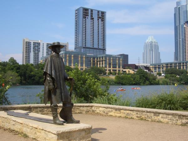 Modern fold down couch & 2 ottomans in living area
