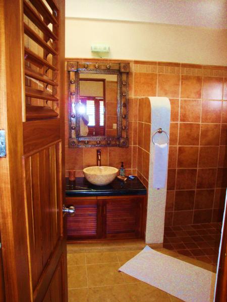 One of three full bathrooms w/shower and tile