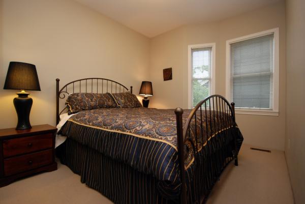 Bedroom 2 with queen wrought iron bed