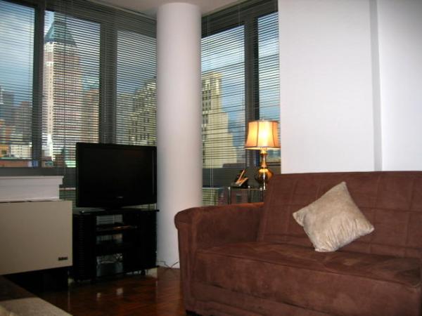 Liv. room with wrap-around wall-to-ceiling windows