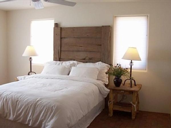 Peaceful guest room with antique headboard