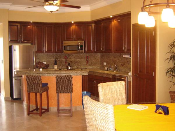 Kitchen w/granite island & GE Profile appliances
