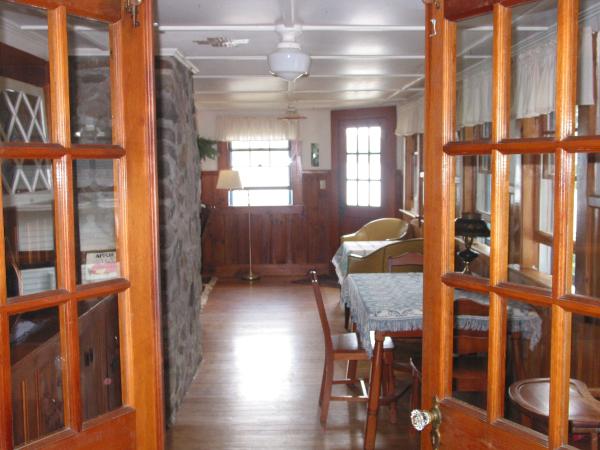 Thru French doors from kitchen > add'l dining area