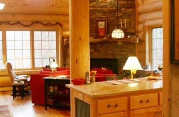 View of kitchen island & great room from entry.