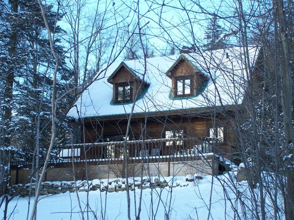 View of the back of the house in the snow
