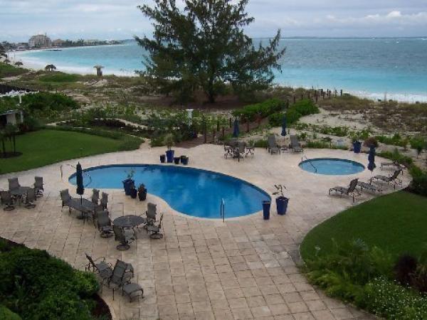 Pool & Hot Tub steps out door with Beach beyond.