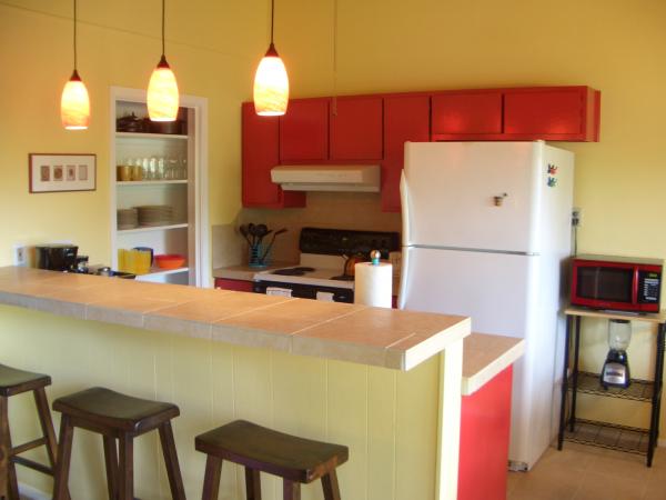 Fully equipped kitchen with tile counters & floors