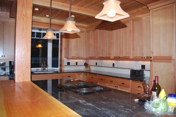 Gourmet kitchen w/ granite counter tops and bar